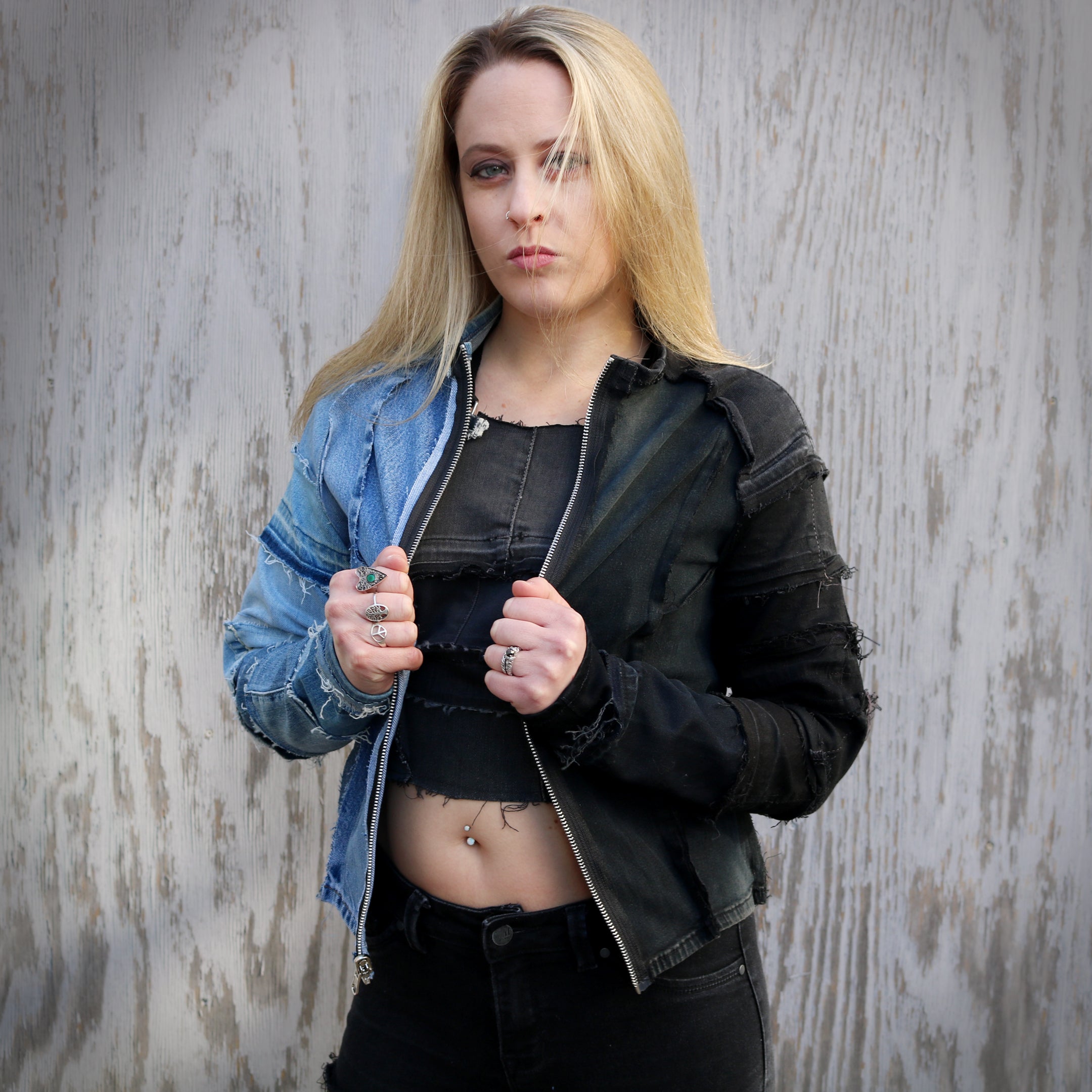 Female model wearing #REMIXbyStevieLeigh black and blue denim jacket